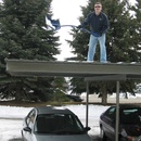 Cleaning snow off the carport