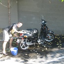 Jason washing the scooter